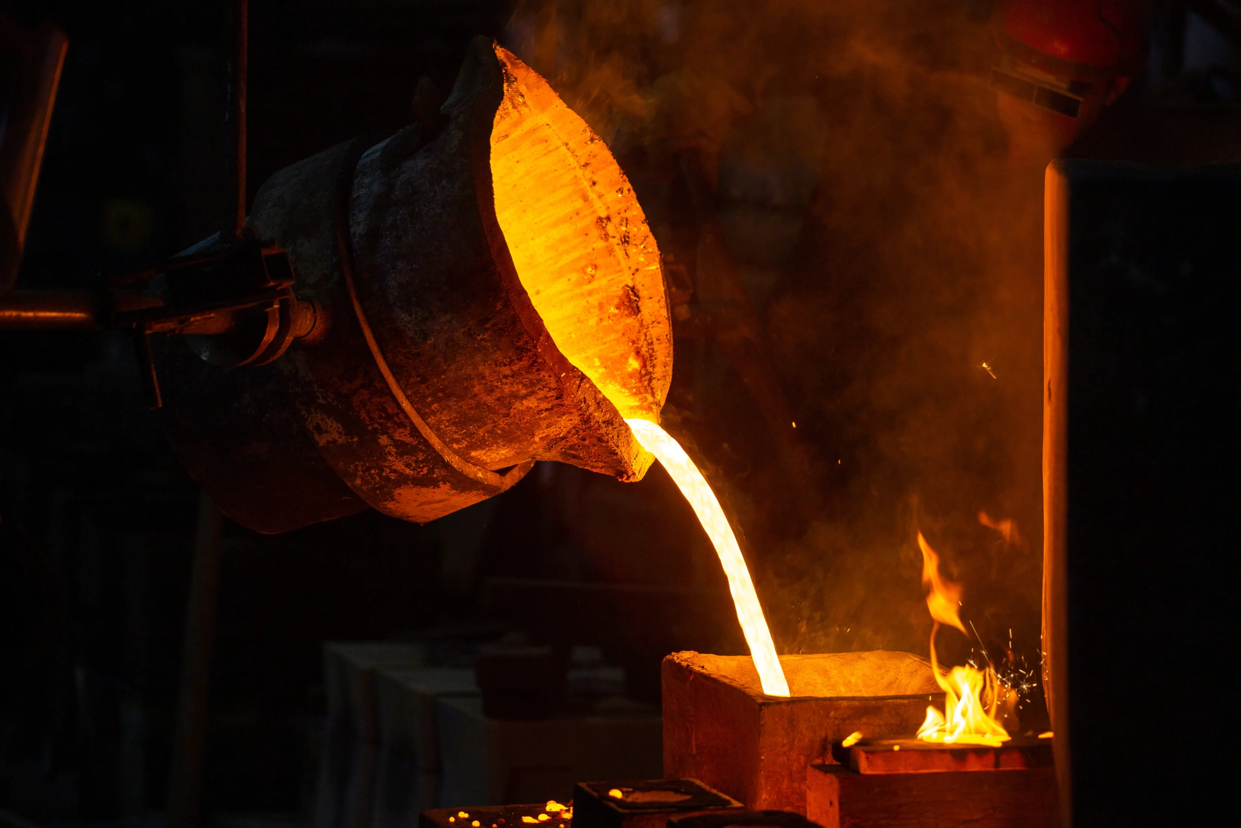 closeup-view-industrial-chill-casting-process-filling-out-mold-with-molten-metal