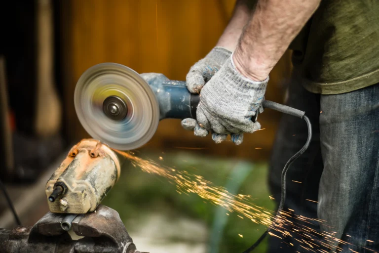 man-working-with-grinder-saw-close-up-view-tool-electric-saw-hands-worker-with-sparks-worker-cutting-metal-with-grinder